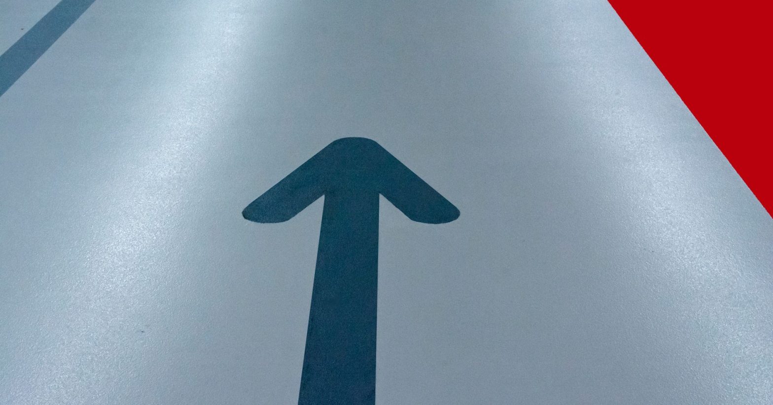 A floor marked with arrows directing upward towards success.